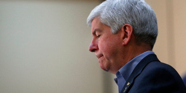 Gov. Rick Snyder speaks after attending a Flint Water Interagency Coordinating Committee meeting, Friday, Feb. 26, 2016 in Flint, Mich. The Detroit Free Press and The Detroit News reported Friday that Valerie Brader, Snyder's senior policy adviser and deputy legal counsel, and chief legal counsel Mike Gadola expressed concerns about Flint's water in October 2014, nearly six months after Flint had begun using the river water to save money. (AP Photo/Paul Sancya)