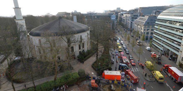 A picture taken on November 26, 2015 shows ambulances, police and fire fighter vehicles outside the mosque after a suspect letter with powder was found at the Great Mosque in Brussels on November 26, 2015. AFP PHOTO / BELGA / ERIC LALMAND ***BELGIUM OUT*** / AFP / BELGA / ERIC LALMAND (Photo credit should read ERIC LALMAND/AFP/Getty Images)