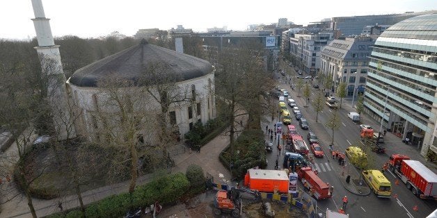 A picture taken on November 26, 2015 shows ambulances, police and fire fighter vehicles outside the mosque after a suspect le