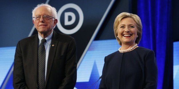 Democratic presidential candidates, Hillary Clinton and Sen. Bernie Sanders, I-Vt, stand together before the start of the Univision, Washington Post Democratic presidential debate at Miami-Dade College, Wednesday, March 9, 2016, in Miami, Fla. (AP Photo/Wilfredo Lee)