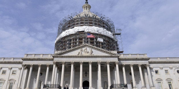 WASHINGTON D.C., March 23, 2016 -- The U.S. flag is seen at half-staff on Capitol Building in honor of the victims of the Brussels attacks, in Washington, D.C. March 23, 2016. (Xinhua/Yin Bogu via Getty Images)