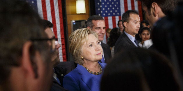 Hillary Clinton, former Secretary of State and 2016 Democratic presidential candidate, speaks with the media after a round table discussion at the University of Southern California (USC) in Los Angeles, California, U.S., on Thursday, March 24, 2016. More than halfway through a nomination race that she entered as the clear favorite, Clinton finds herself deadlocked with Bernie Sanders among Democrats. Photographer: Patrick T. Fallon/Bloomberg via Getty Images 