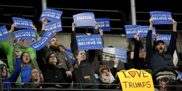 Supporters cheer for Democratic presidential candidate Bernie Sanders during a rally at Safeco Field in Seattle on March 25, 2016. / AFP / Jason Redmond (Photo credit should read JASON REDMOND/AFP/Getty Images)