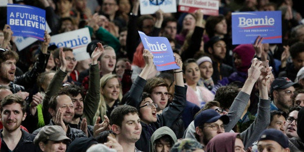 Supporters cheer as Democratic presidential candidate Bernie Sanders speaks during a rally at Safeco Field in Seattle on March 25, 2016. / AFP / Jason Redmond (Photo credit should read JASON REDMOND/AFP/Getty Images)