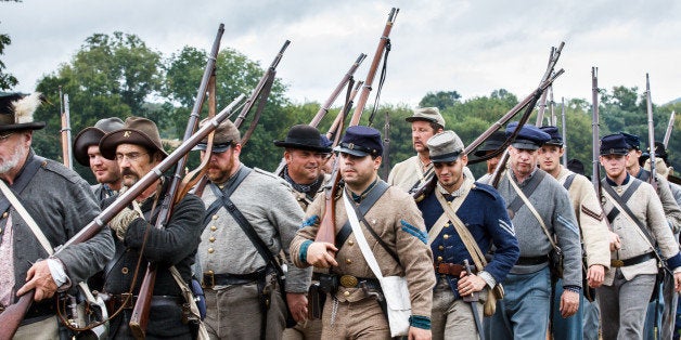 Confederate Soldiers in Military Uniform and With Rifles March to the Battlefield During the 150th Anniversary of the Historic Battle of Chickamauga American Civil War Reenactment Held in Georgia. Over 5000 Confederate, Union Soldiers and Family Came