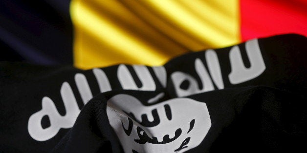 Islamic State flag is seen in front of a Belgian flag in this illustration taken March 22, 2016. REUTERS/Dado Ruvic/Illustrat