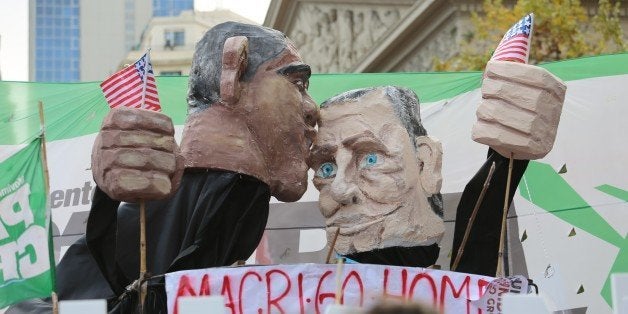 BUENOS AIRES, ARGENTINA - MARCH 24: People protest against President of Argentina Mauricio Macri and President of the United States Barack Obama during the Day of Remembrance for Truth and Justice marking the 40th year of the military coup took place in 1976, in Buenos Aires, Argentina on March 24, 2016. (Photo by Omer Musa Targal/Anadolu Agency/Getty Images)