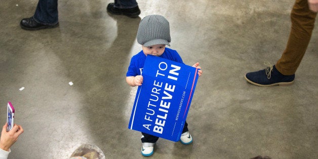 MADISON, WI - MARCH 26: Nineteen-month-old Craig Fietzer waits with his mother for the arrival of Democratic presidential ca