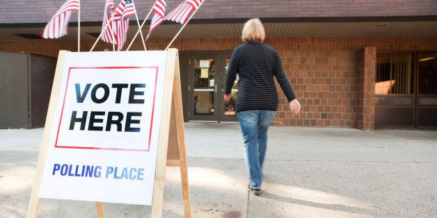 Subject: A voter approaching an election polling place station during a United States election.