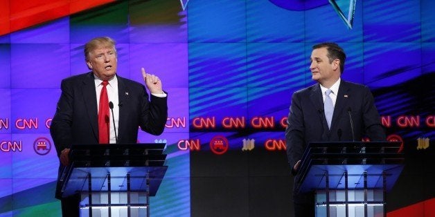 Republican presidential candidate, businessman Donald Trump speaks, as Republican presidential candidate, Sen. Ted Cruz, R-Texas, listens, during the Republican presidential debate sponsored by CNN, Salem Media Group and the Washington Times at the University of Miami, Thursday, March 10, 2016, in Coral Gables, Fla. (AP Photo/Wilfredo Lee)