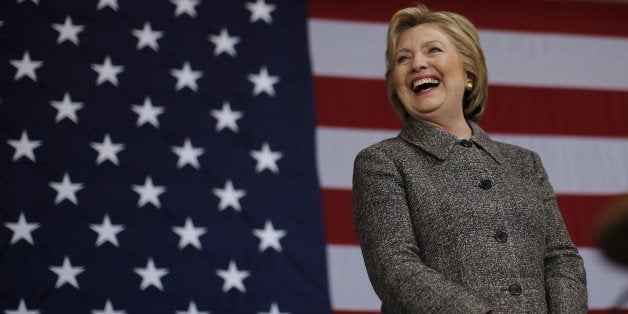 U.S. Democratic presidential candidate Hillary Clinton laughs during a campaign event in La Crosse, Wisconsin, United States, March 29, 2016. REUTERS/Jim Young 