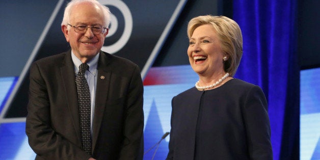 Democratic presidential candidates, Hillary Clinton and Sen. Bernie Sanders, I-Vt, shake hands before the start of the Univision, Washington Post Democratic presidential debate at Miami-Dade College, Wednesday, March 9, 2016, in Miami, Fla. (AP Photo/Wilfredo Lee)