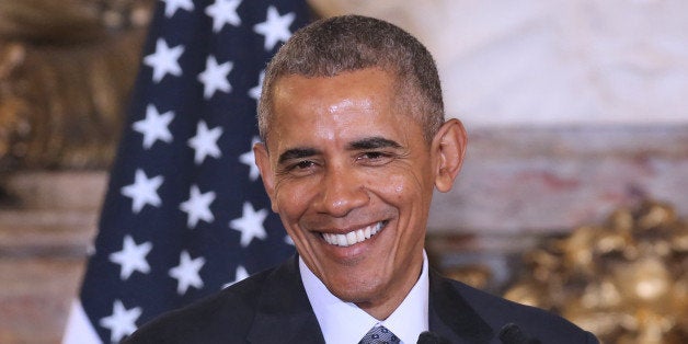 US President Barack Obama smiles during a joint press conference with Argentinian President Mauricio Macri (out of frame) at
