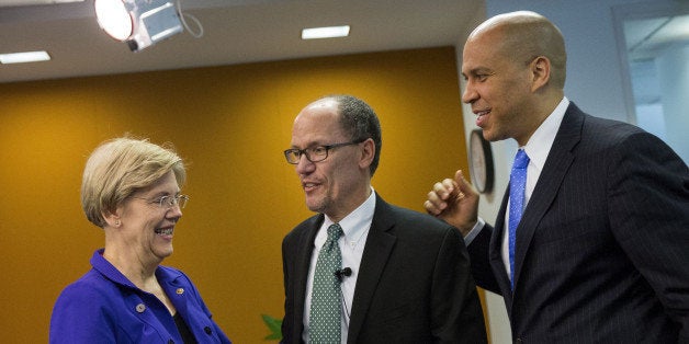 Senator Elizabeth Warren, a Democrat from Massachusetts, from left, Thomas Perez, U.S. Secretary of Labor, and Senator Cory Booker, a Democrat from New Jersey, speak after a U.S. Labor Department panel discussion at the Center for American Progress in Washington, D.C., U.S., on Wednesday, April 6, 2016. The Labor Department announced sweeping rules Wednesday that could transform the financial advice given to people saving for retirement by requiring brokers and advisers to put their clients' interest first. Photographer: Drew Angerer/Bloomberg via Getty Images 