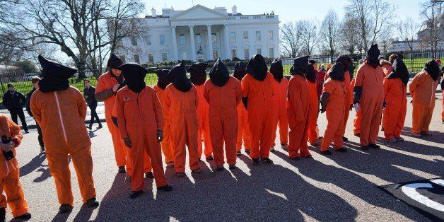 Demonstrators take part in a protest calling for the closure of the Guantanamo Bay prison on January 11, 2016 in front of the White House in Washington, DC. US President Barack Obama is expected to present his plan on closing the facility during his final State of the Union address. AFP PHOTO/MANDEL NGAN / AFP / MANDEL NGAN (Photo credit should read MANDEL NGAN/AFP/Getty Images)