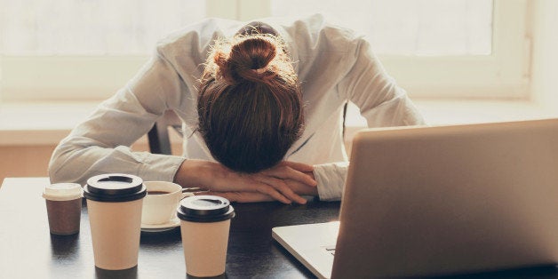 Tired businesswoman in the office