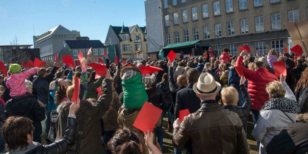 Thousands of Icelanders rally in Reykjavik on April 9, 2016 to demand immediate elections on a sixth consecutive day of anti-government protests over the 'Panama Papers' revelations which have already toppled the prime minister. / AFP / HALLDOR KOLBEINS (Photo credit should read HALLDOR KOLBEINS/AFP/Getty Images)