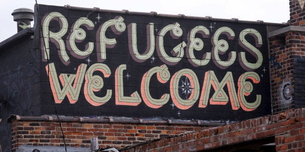 'Refugees Welcome' is seen painted on a building in a blighted area near downtown Detroit, Michigan November 17, 2015. REUTERS/Rebecca Cook