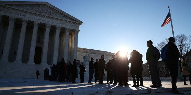 WASHINGTON, DC - JANUARY 11: People wait in line to enter the US Supreme Court building January 11, 2016 in Washington, DC. The high court is hearing arguments inÃthe Friedrichs v. California Teachers Association case. The case will decide whether California and twenty two other states can make public-employees, such as public school teacher Rebecca Friedrichs, to pay union agency fees. (Photo by Mark Wilson/Getty Images)