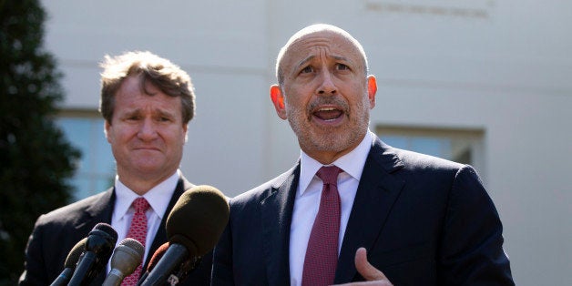 Lloyd Blankfein, Chairman and CEO of The Goldman Sachs Group speaks alongside Brian Moynihan, CEO of Bank of America, after a meeting by the Financial Services Forum with U.S. President Barack Obama (not pictured) at the White House in Washington, October 2, 2013. REUTERS/Jason Reed (UNITED STATES - Tags: POLITICS BUSINESS)