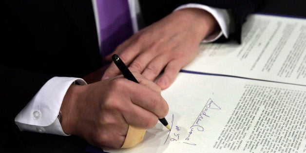 NEW YORK, NY - APRIL 4: New York Gov. Andrew Cuomo, signs a law that will gradually raise New York's minimum wage to $15, at the Javits Convention Center April 4, 2016 in New York City. On Friday, the New York Legislature passed a plan that would gradually raise the minimum wage to $15 in New York City by the end of 2018 and in some prosperous suburbs by the end of 2021. The minimum wage would only rise to $12.50 in the rest of the state by 2020, with further increases tied to inflation and other economic indicators. (Photo by Richard Drew-Pool/Getty Images)