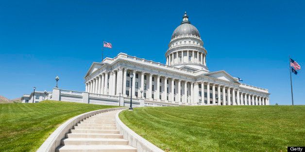 Stars and Stripes flying proudly over Capitol Hill above the steps to the Utah State Capitol, its magnificent renovated columns and monumental dome under clear blue desert skies, Salt Lake City, Utah. ProPhoto RGB profile for maximum color fidelity and gamut.