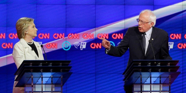 Democratic presidential candidates Sen. Bernie Sanders, I-Vt., right, and Hillary Clinton speak during the CNN Democratic Presidential Primary Debate at the Brooklyn Navy Yard on Thursday, April 14, 2016 in New York. (AP Photo/Seth Wenig)