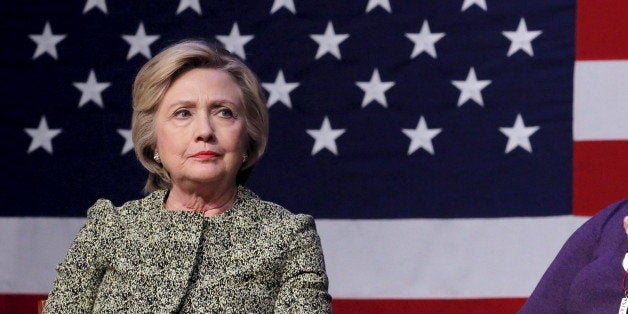 Democratic U.S. presidential candidate Hillary Clinton listens to the family members of victims of gun violence speak during