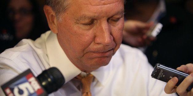 NEW YORK, NY - APRIL 16: Republican presidential candidate John Kasich talks with reporters after having lunch at PJ Bernstein's Deli Restaurant on April 16, 2016 in New York City. John Kasich is campaigning throughout New York ahead of the state's presidential primary on Tuesday. (Photo by Justin Sullivan/Getty Images)