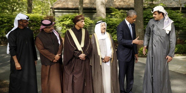 U.S. President Barack Obama shakes hands with the Emir of Qatar Sheikh Tameem bin Hamad Al Thani while hosting the six-nation Gulf Cooperation Council (GCC) at Camp David in Maryland May 14, 2015. From left are UAE Crown Prince Sheikh Mohammed bin Zayed al-Nahyan, Bahrain Crown Prince Salman bin Hamad Al-Khalifa, Oman Deputy Prime Minister Sayyid Fahd bin Mahmoud Al Said, the Emir of Kuwait Sheikh Sabah Al-Ahmed Al-Jaber Al-Sabah. REUTERS/Kevin Lamarque TPX IMAGES OF THE DAY 