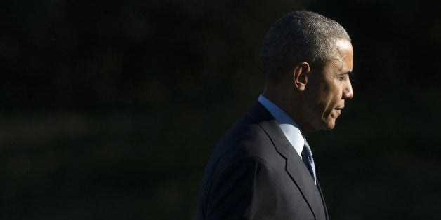 US President Barack Obama walks across the South Lawn after arriving on Marine One at the White House in Washington, DC, March 29, 2016, following a trip to Atlanta to speak about drug addiction. / AFP / SAUL LOEB (Photo credit should read SAUL LOEB/AFP/Getty Images)