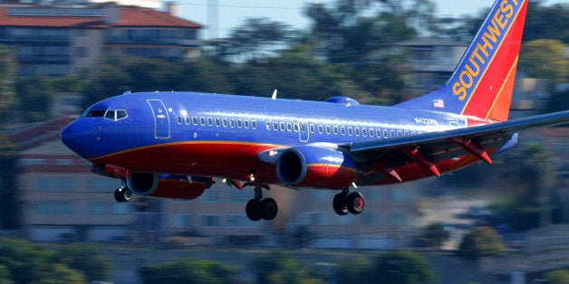 A Southwest Airlines jet comes in to land at Lindbergh Field in San Diego, California February 25, 2015. Southwest Airlines Co said it pulled 128 aircraft out of service on Tuesday after it discovered that they were overdue for a required check of the standby hydraulic system that serves as a backup to the planes' primary systems. REUTERS/Mike Blake (UNITED STATES - Tags: TRANSPORT BUSINESS)