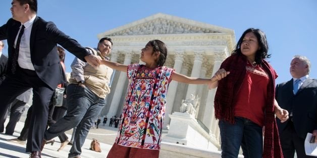 Sophie Cruze (C), of Los Angeles, and other supporters of US President Barack Obama's immigration reforms leave the US Supreme Court after arguments in United States vs Texas were heard April 18, 2016 in Washington, DC.Hundreds of protesters rallied Monday outside the US Supreme Court as it weighed a major immigration case that could impact the fate of millions of people facing possible deportation and further raise the stakes in the 2016 White House race. / AFP / Brendan Smialowski (Photo credit should read BRENDAN SMIALOWSKI/AFP/Getty Images)
