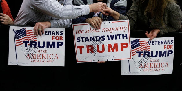 A supporter holds a sign after Republican presidential candidate Donald Trump speaks during a campaign stop Wednesday, April 20, 2016, in Indianapolis. (AP Photo/Darron Cummings)