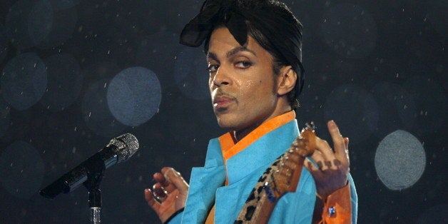 Prince performs during the halftime show of the NFL's Super Bowl XLI football game between the Chicago Bears and the Indianap
