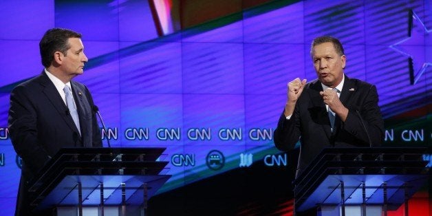 Republican presidential candidate, Ohio Gov. John Kasich, right, speaks as Republican presidential candidate, Sen. Ted Cruz, R-Texas, listens, during the Republican presidential debate sponsored by CNN, Salem Media Group and the Washington Times at the University of Miami, Thursday, March 10, 2016, in Coral Gables, Fla. (AP Photo/Wilfredo Lee)