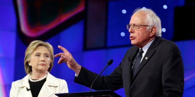 Democratic presidential candidate Sen. Bernie Sanders, I-V.t, right, speaks as Hillary Clinton listens during the CNN Democra