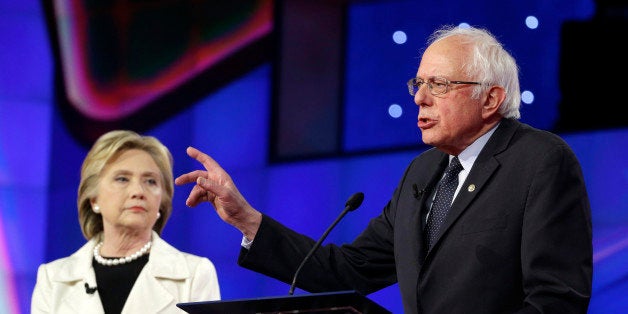 Democratic presidential candidate Sen. Bernie Sanders, I-V.t, right, speaks as Hillary Clinton listens during the CNN Democratic Presidential Primary Debate at the Brooklyn Navy Yard on Thursday, April 14, 2016 in New York. (AP Photo/Seth Wenig)