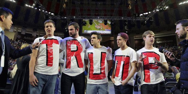 LYNCHBURG, VA - JANUARY 18: Liberty University students (L-R) Austin Miller, James Ford, Jeremy Boyd, Josiah O'Boyle and Cody Hildebrand wear home made t-shirts spelling 'TRUMP' while waiting for the arrival of Republican presidential candidate Donald Trump during a campaign rally in the Vines Center at the university January 18, 2016 in Lynchburg, Virginia. A billionaire real estate mogul and reality television personality, Trump addressed students and guests at the non-profit, private Christian university that was founded in 1971 by evangelical Southern Baptist televangelist Jerry Falwell. (Photo by Chip Somodevilla/Getty Images)