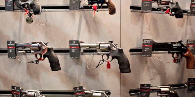 Revolvers sit on display in the Smith & Wesson booth on the exhibition floor of the 144th National Rifle Association (NRA) Annual Meetings and Exhibits at the Music City Center in Nashville, Tennessee, U.S., on Saturday, April 11, 2015. Top Republican contenders for their party's 2016 presidential nomination are lining up to speak at the annual NRA event, except New Jersey Governor Chris Christie and Kentucky Senator Rand Paul, who were snubbed by the country's largest and most powerful gun lobby. Photographer: Daniel Acker/Bloomberg via Getty Images