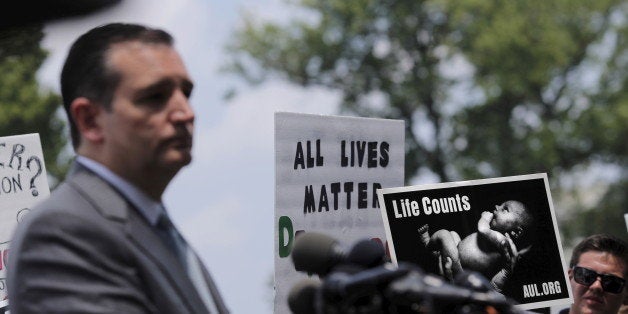 A supporters holds a sign as Republican presidential candidate Senator Ted Cruz (R-TX) speaks at the "Women Betrayed Rally to Defund Planned Parenthood" at Capitol Hill in Washington July 28, 2015. Senate Majority Leader Mitch McConnell is planning to hold a vote on legislation in coming days on a Republican bill halting federal funding of Planned Parenthood, following the release of videos involving use of aborted fetal tissue for medical research. REUTERS/Carlos Barria