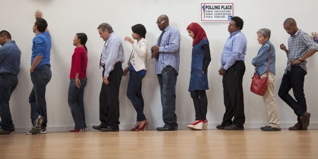 Voters waiting to vote in polling place