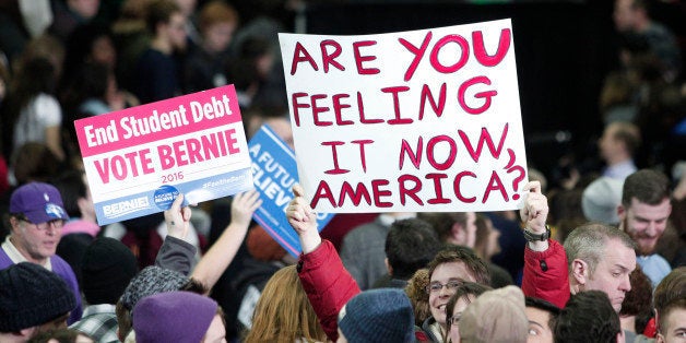 YPSILANTI, MI - FEBRUARY 15: Supporters of U.S. Senator and Democratic Presidential Candidate Bernie Sanders hold signs at