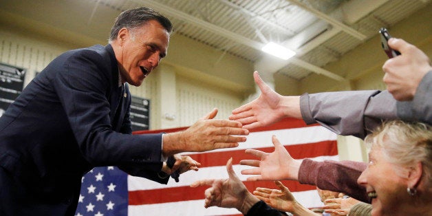 Former Republican presidential candidate Mitt Romney meets with attendees at a Republican presidential candidate, Ohio Gov. J