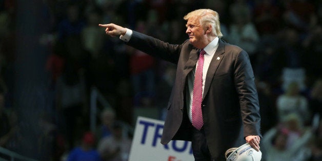 CHARLESTON, WV - MAY 05: Republican Presidential candidate Donald Trump points to supporters following his speech at the Charleston Civic Center on May 5, 2016 in Charleston, West Virginia. Trump became the Republican presumptive nominee following his landslide win in indiana on Tuesday.(Photo by Mark Lyons/Getty Images)