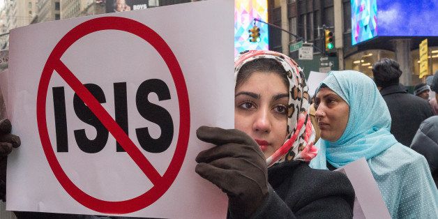 TIMES SQUARE, NEW YORK, NY, UNITED STATES - 2016/01/17: Demonstrators hold signs while participating in the Times Square rally. Nearly 1000 members of the Muslim-American community from New York, Illinois and Michigan rallied in Times Square against the Saudi Arabian government's recent execution of Shiite cleric Sheikh Nimr al-Nimr and 46 followers, the recent massacre in Zaria, Nigeria and the pending execution of Sheikh Ibrahim Zakzay. (Photo by Albin Lohr-Jones/Pacific Press/LightRocket via Getty Images)