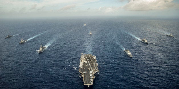 Waters East of Okinawa, July 30, 2014 - The aircraft carrier USS George Washington (CVN 73) and ships from the U.S. Navy, the Indian Navy, and the Japan Maritime Self-Defense Force participate in a photo exercise during Malabar 2014.