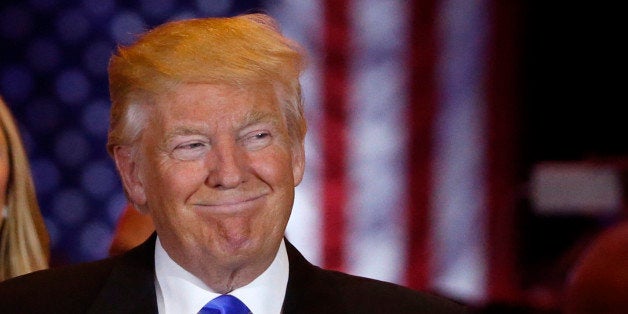 Republican U.S. presidential candidate Donald Trump smiles as he speaks at the start of a campaign victory party after rival