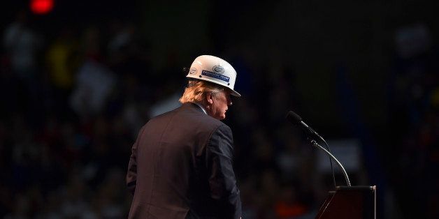 CHARLESTON, WV - MAY 5: Republican presidential candidate Donald Trump wears a coal miner's protective hat while addressing his supporters during a rally at the Charleston Civic Center on May 5, 2016 in Charleston, WV. (Photo by Ricky Carioti/The Washington Post via Getty Images)