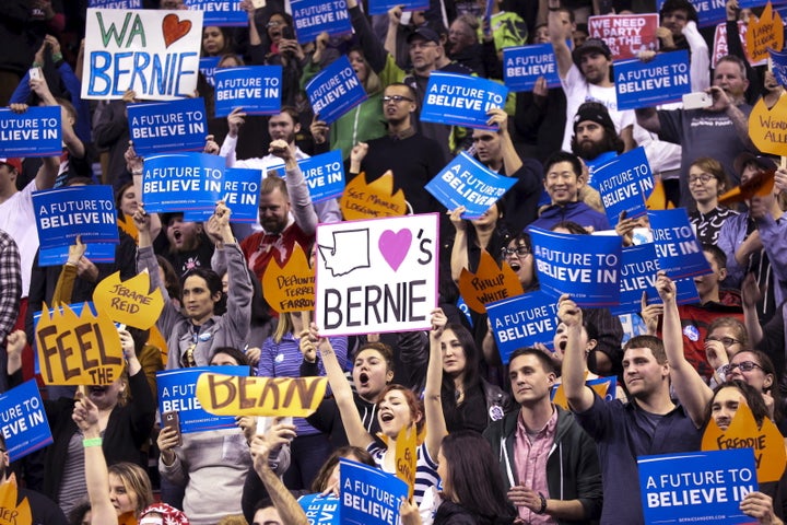 Supporters of Democratic U.S. presidential candidate Bernie Sanders cheer during a rally at Key Arena in Seattle, Washington March 20, 2016. REUTERS/David Ryder